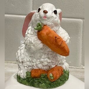 Cute rabbit with carrots statute - rabbit sparkles in light (see video)